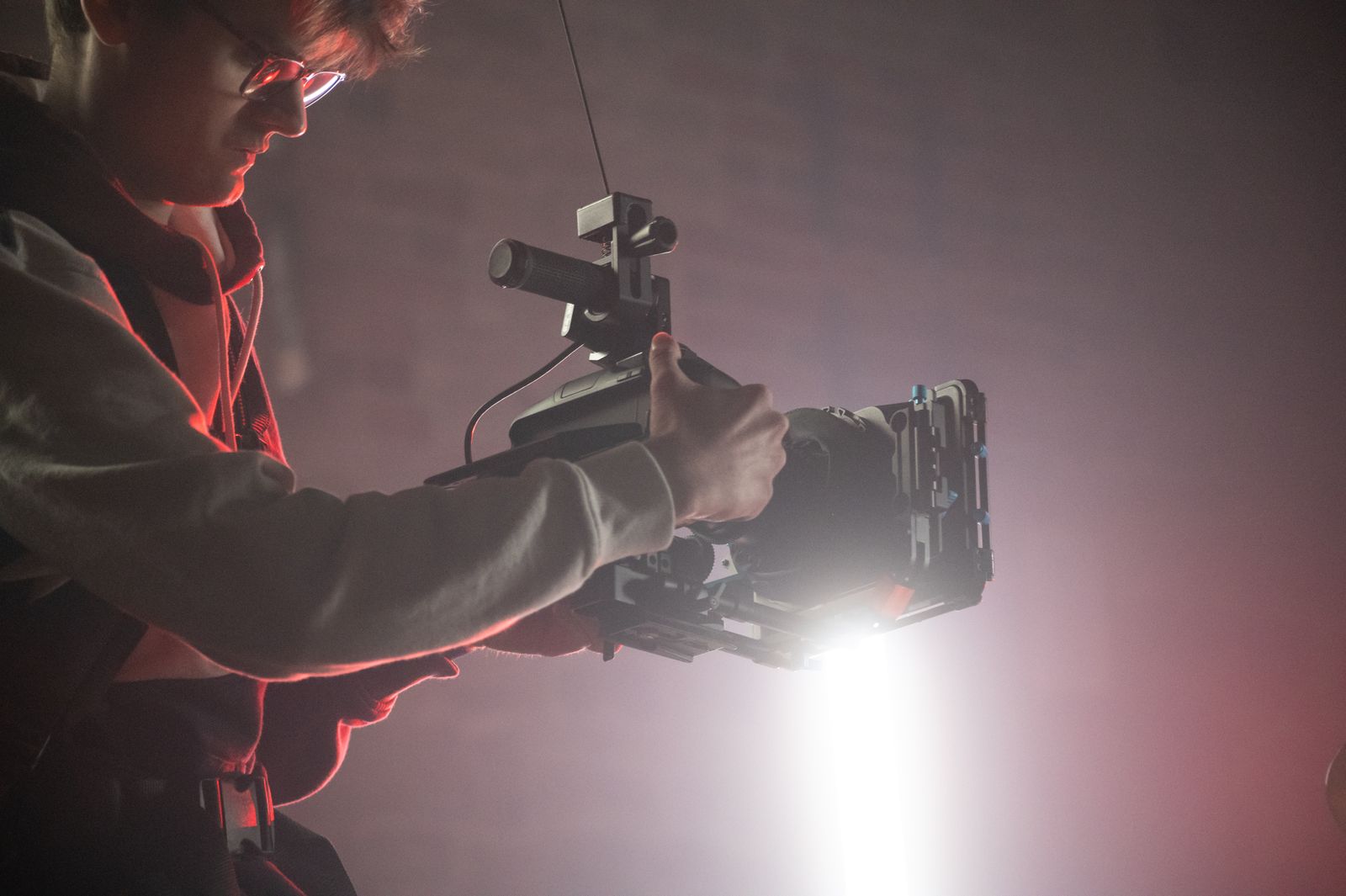 Film camera operator working on a professional production set